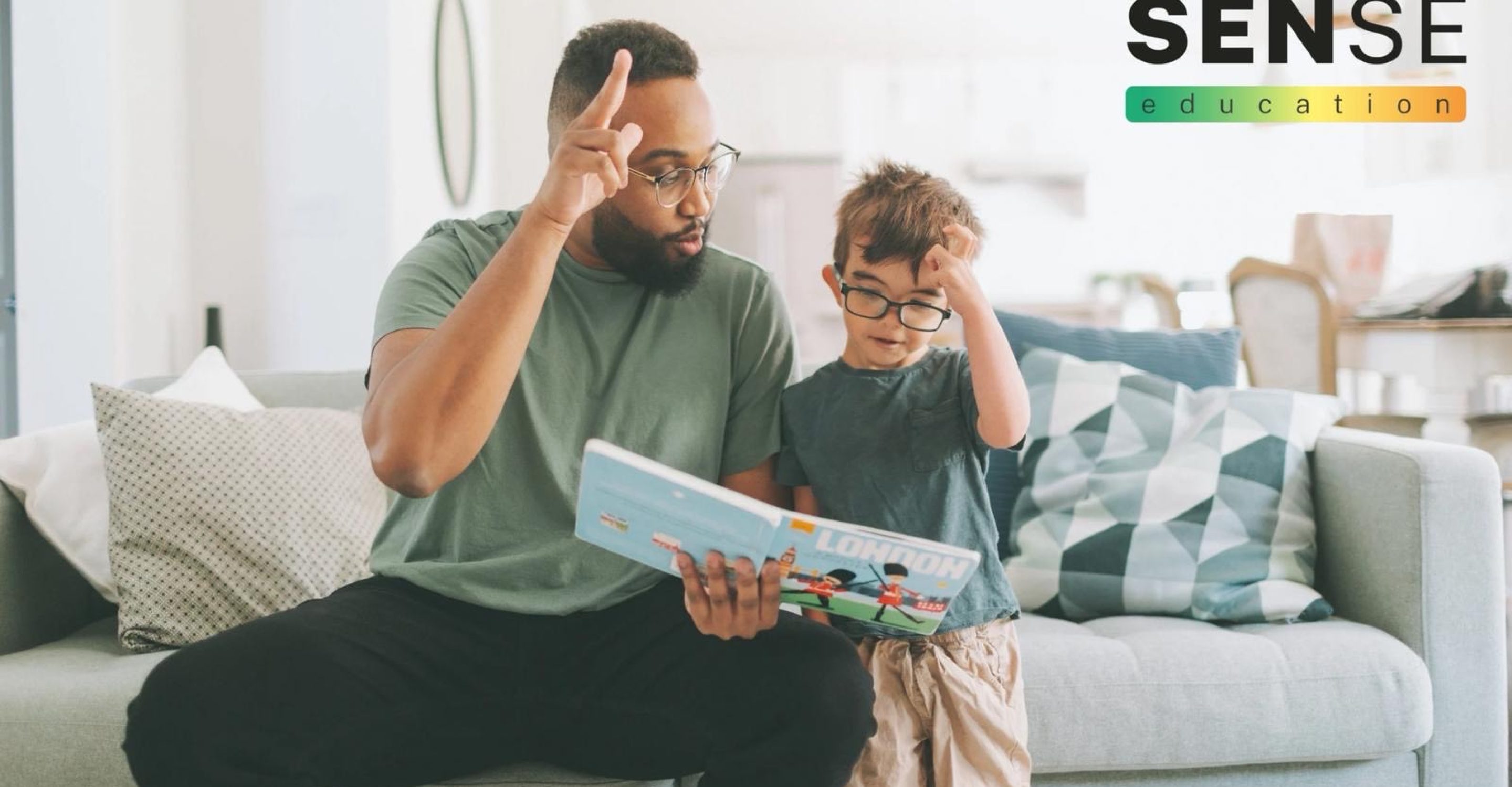 SEND child learning makaton with male teacher